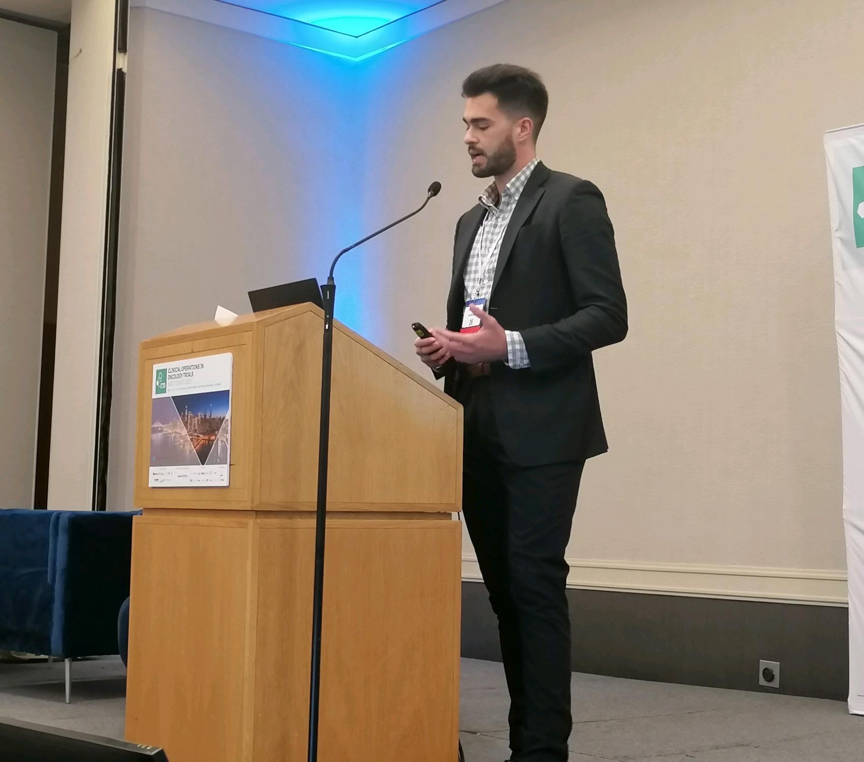 Sakis Paliouras presenting at an oncology industry conference