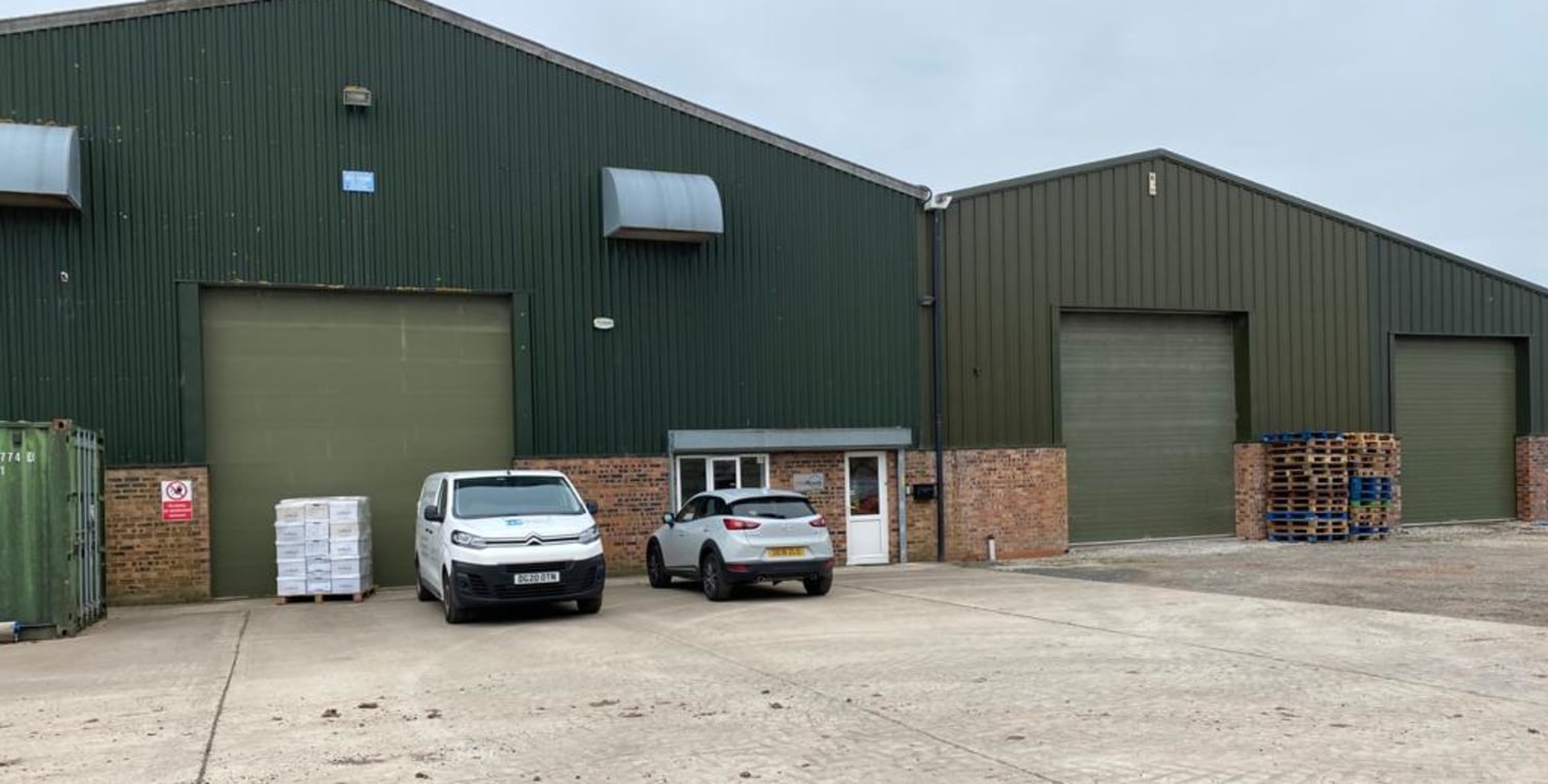 Description 

The warehouse is in 3 bays with a small office and toilet and each bay having an up and over loading door. The bays are of steel portal frame construction with a height to eaves of 7m. External elevations are profile steel clad above lo...