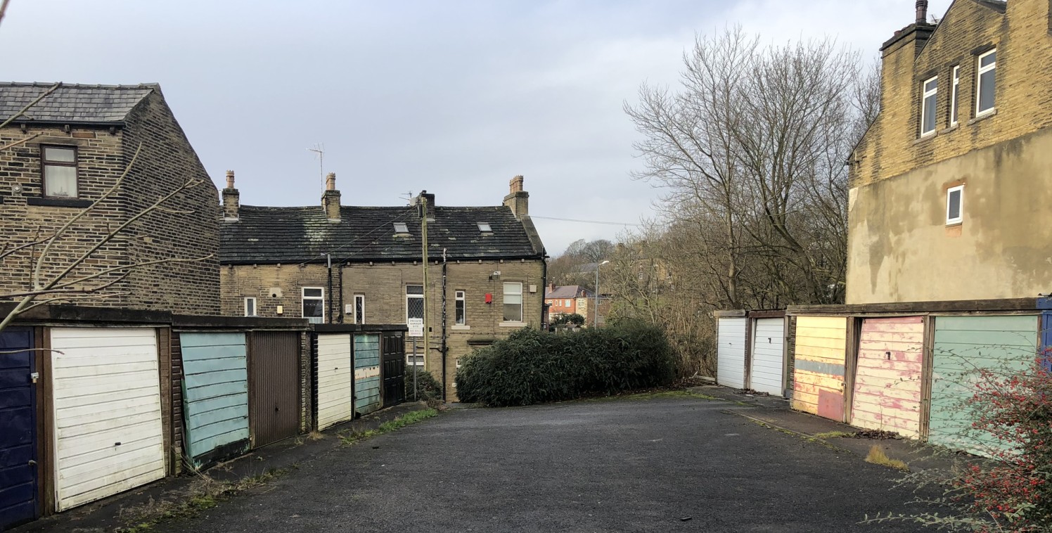 The property briefly comprises two parallel terraces of eight vacant lock-up garages separated by a strip of tarmac surfaced yard. The site is broadly rectangular in shape and of level topography throughout.