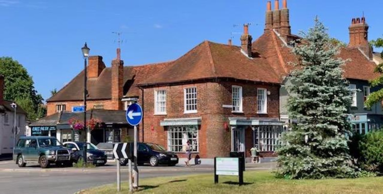 The property comprises a very prominent two storey Grade II Listed building with frontages to London End and Aylesbury End. It has a lockup shop on ground floor and a separate two-bedroom flat on first floor, which has been 'sold off' on a long-lease...