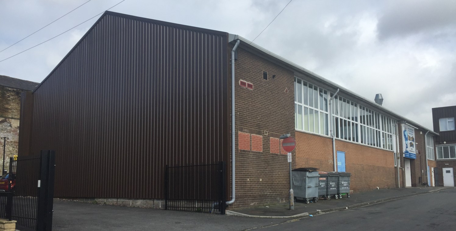 The property briefly comprises a single storey high bay industrial unit with two storey offices and mezzanine level. The unit benefits from:

Solid concrete floor;

Roller shutter access with UPVC framed entrance;

Fluorescent strip lighting;

Gas sp...