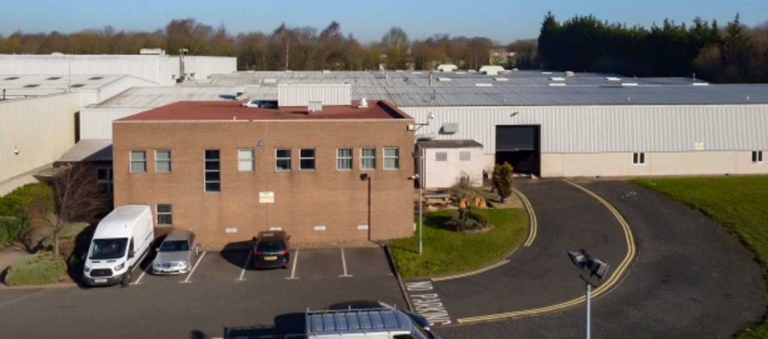 The property comprises a substantial detached warehouse facility with attached two-storey office block on a self-contained site including a generous tarmacadam car park to the front.<br><br>The warehouse is of steel portal frame construction, arrange...