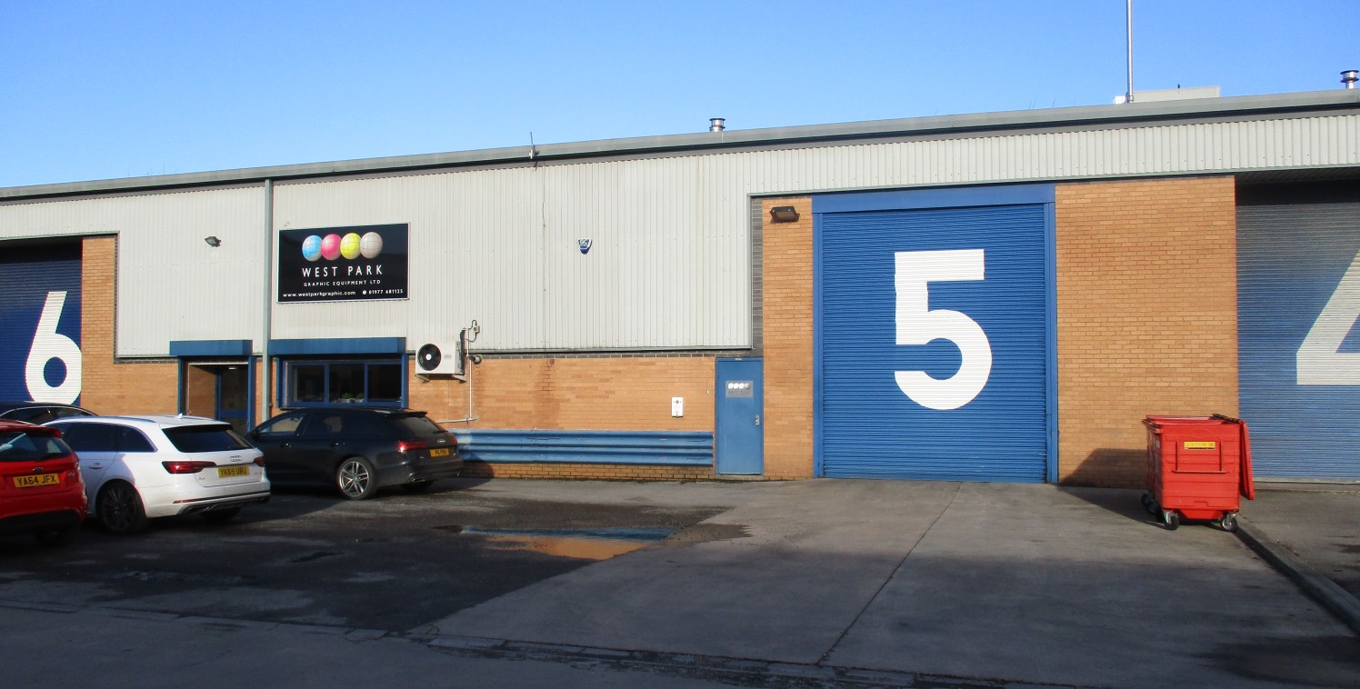 The property is a modern mid terrace industrial unit constructed around a steel portal frame with brick and metal profile cladding under a pitched profile sheet roof. The property benefits from: