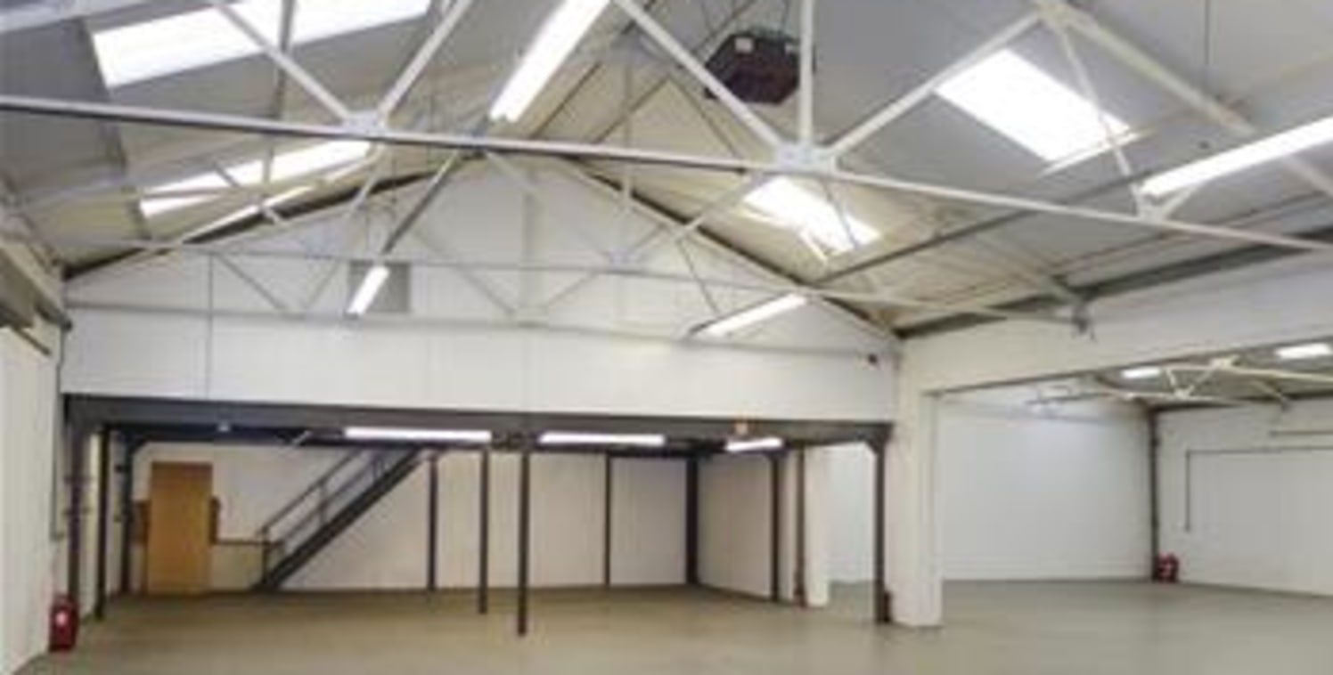 The premises comprise an industrial/warehouse unit of steel portal frame construction with brickwork elevations and a pitched roof. The warehouse area benefits from a clear open plan layout while ancillary offices are located to the first floor level...