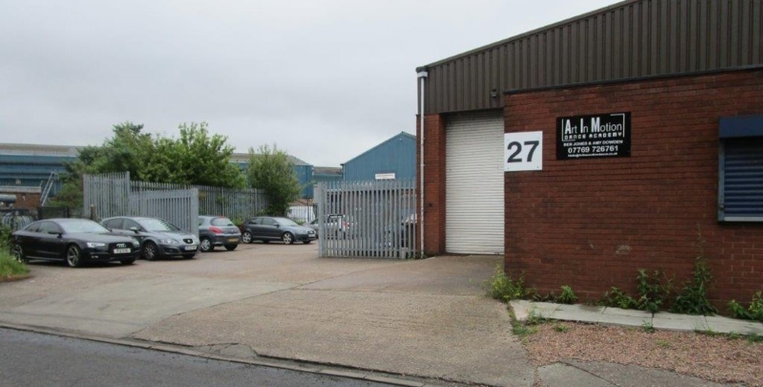 The unit is constructed of steel portal frame with part brick/part profile clad elevations beneath a profile sheet roof incorporating translucent roof lights and a concrete floor. Vehicular access is via a roller shutter door to the front of the unit...