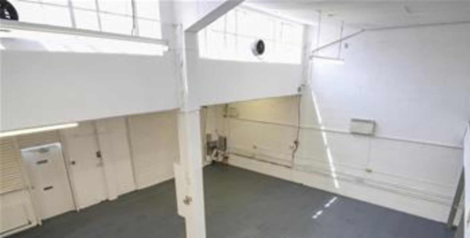 The premises comprise a mid-terrace 1950-60s built warehouse / storage facility constructed of brick elevations to a pitched roof. Access to the warehouse is available via the loading door served by a loading bay....