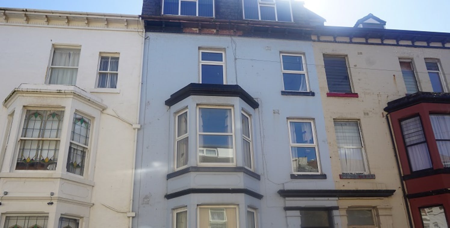 Four storey mid terraced property comprising of 7 self-contained studio flats and a one bedroom self-contained flat plus ground floor owners lounge, en suite bedroom, kitchen and separate shower & wc. The flats are not trading and are in need of a fu...