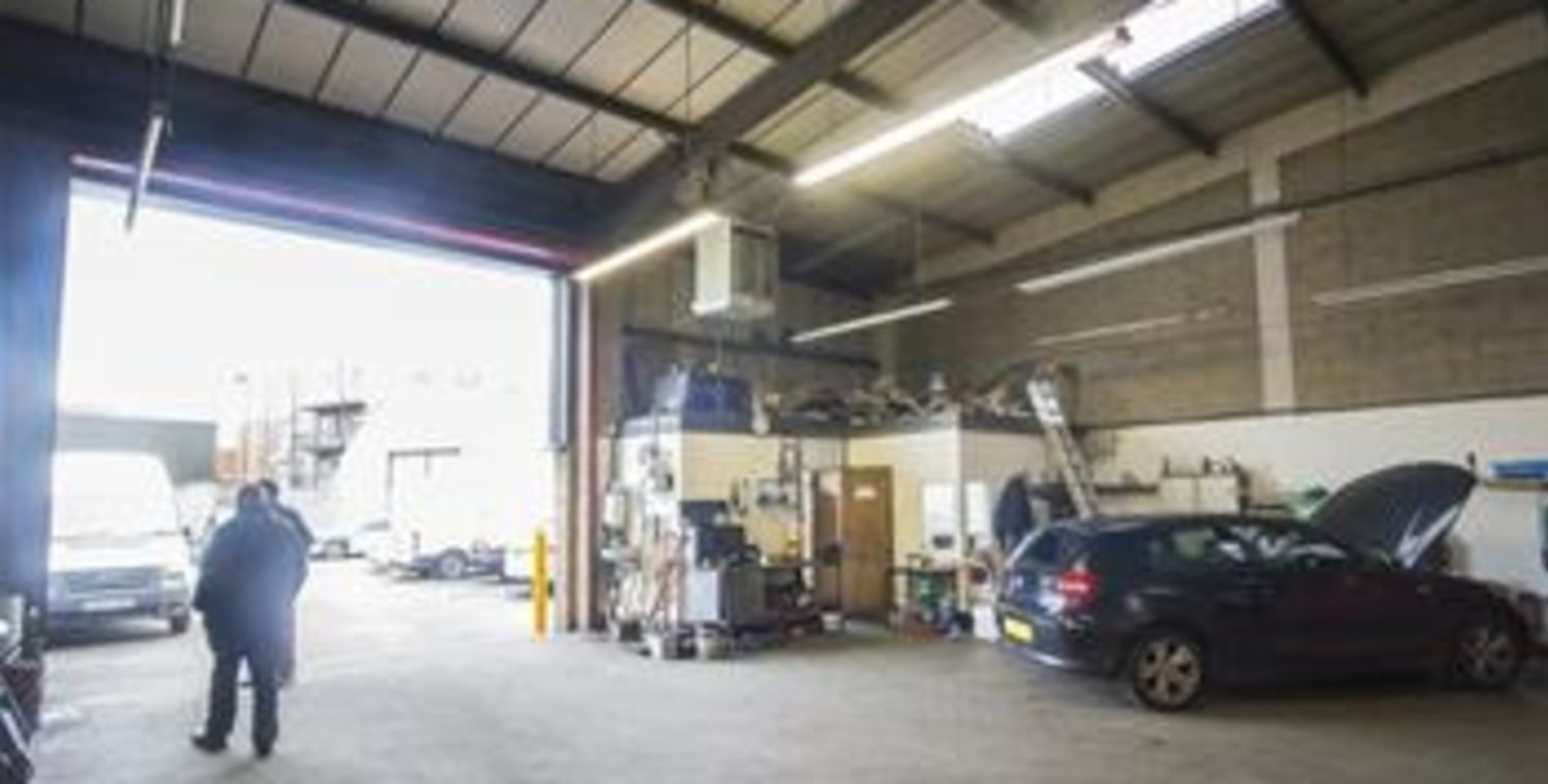 The subject premises comprise of a mid-terrace industrial warehouse unit, primarily of brick and block construction with profile metal cladding to a steel portal frame under a pitched roof. The unit benefits from a maximum eaves height of 6....