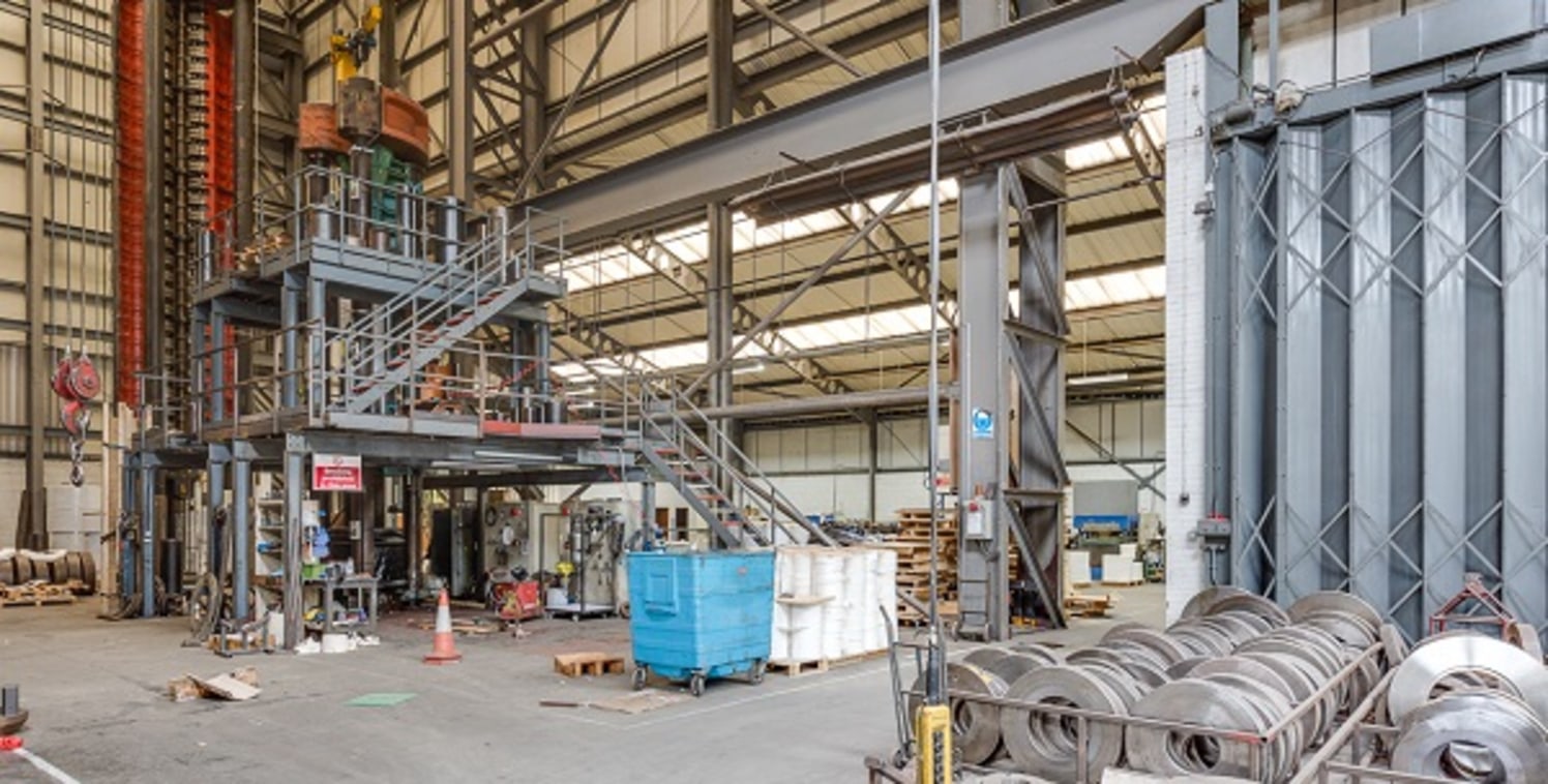 An extensive site incorporating 3 industrial buildings, one which has been converted fully to offices and one with extensive craneage. The site is sloping and has an automated sliding access gate fronting Kestor Street. 

 

Office building A convert...