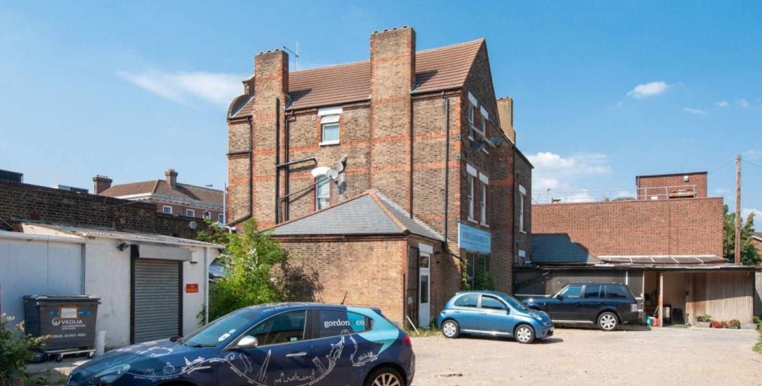 MIXED-USE INVESTMENT PROPERTY COMPRISING A PARADE OF SHOPS, COMMUNITY CENTRE, OFFICE AND TWO 4X BEDROOM FLATS (RENT INCOME &pound;151,500 PA) - EXCELLENT RE-DEVELOPMENT POTENTIAL The property offers significant residential led development opportuniti...