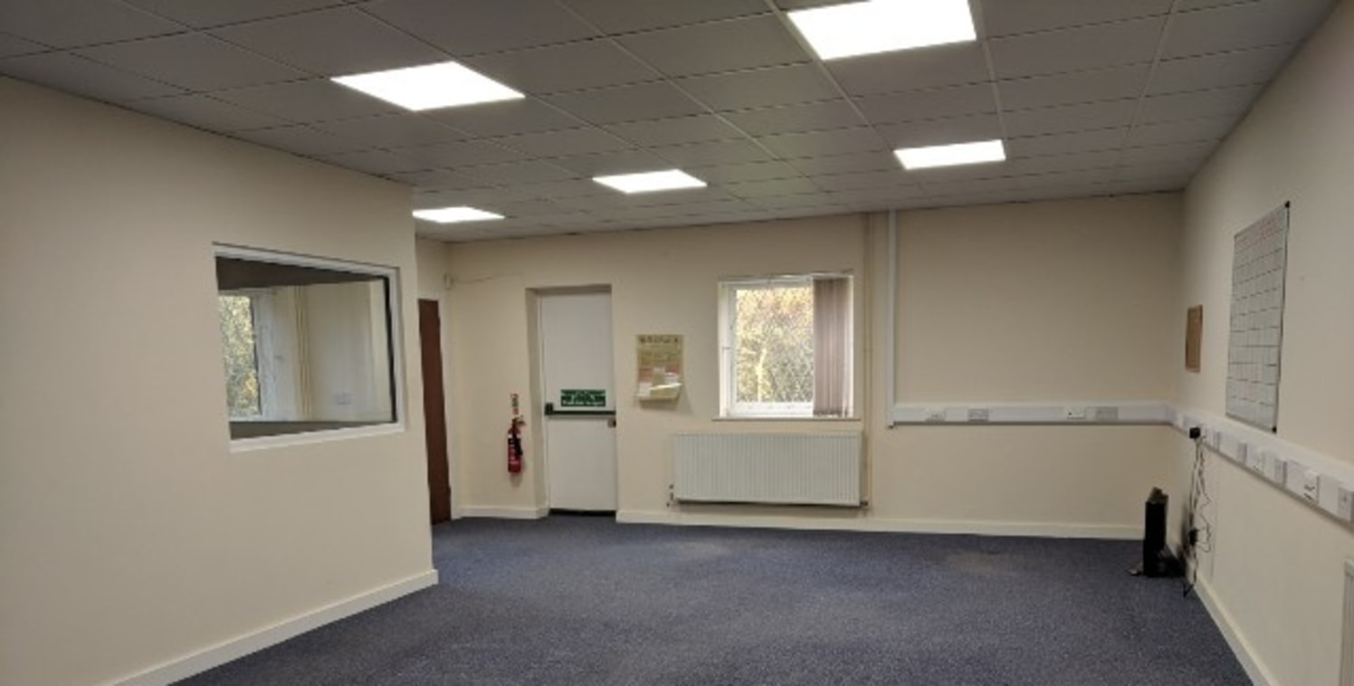 The premises comprise a mid-terraced ground and first floor offices with part ground floor stores. The building is of brick block construction under a tiled pitched roof supported by a timber frame.