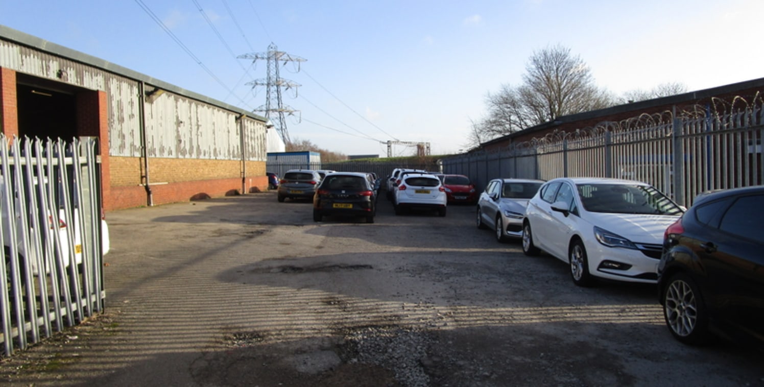 The property comprises a single warehouse/industrial unit with an attached single storey flat roof office. The warehouse is constructed with a steel portal frame with masonry walls to half height under a sheeted roof. The warehouse has a minimum eave...