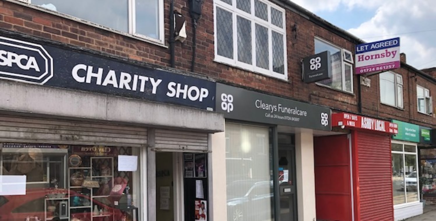 The property forms part of a parade of shops and comprises a small ground floor shop with small staff, w/c and loading area to the rear. Further accommodation is available on the first floor which benefits from separate access if required. To the rea...