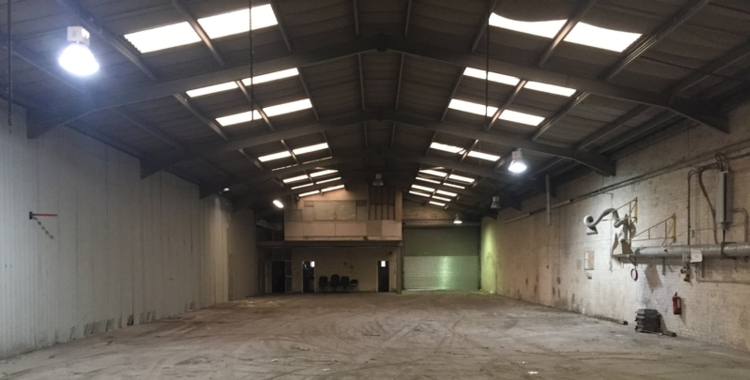 The property is of a steel portal frame construction beneath a pitched lined roof, incorporating intermittent translucent roof lighting. The front of the premises are made up of first storey offices providing a mixture of cellular and open plan offic...