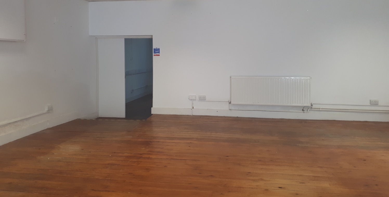 The unit comprises a large open plan area with WC facilities and kitchenette to the rear and a partitioned meeting room.

The building is within an enclosed cobbled courtyard in close proximity to Walthamstow Market and The Scene, which includes an E...