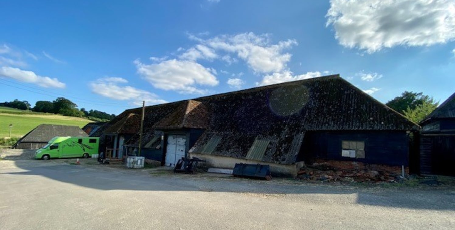 The barn is Listed and includes concrete floor, single phase power, vehicle access doors throughout, lighting and 4m eaves. 

Externally there is parking along the frontage for approx 10 cars.