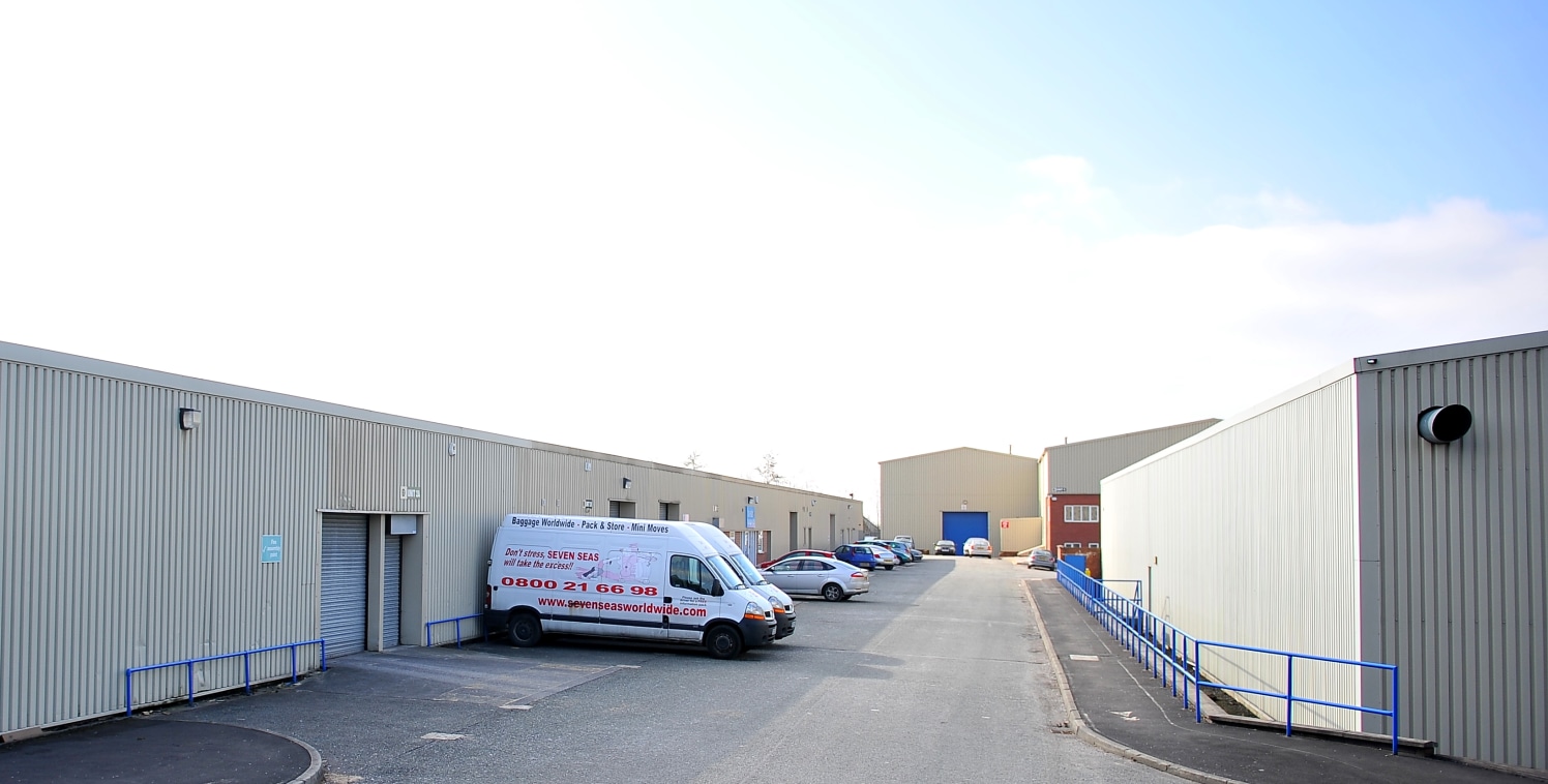 The unit has a steel portal frame roof and fluorescent strip lighting and has a concrete floor. It is accessed via a personnel door into a reception area with internal offices. There is also a roller shutter door to the front of the unit

Unit 2C is...