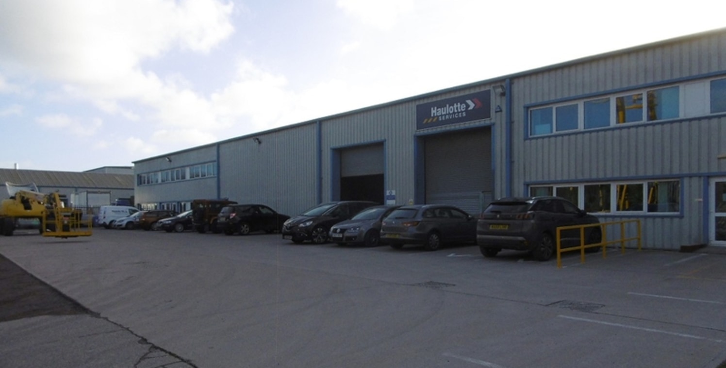 The property provides a modern industrial premises benefiting from a large surfaced and fenced front yard. The unit is accessed via two roller shutter doors to the front elevation and has an internal eaves height of approx. 6.2m (5....