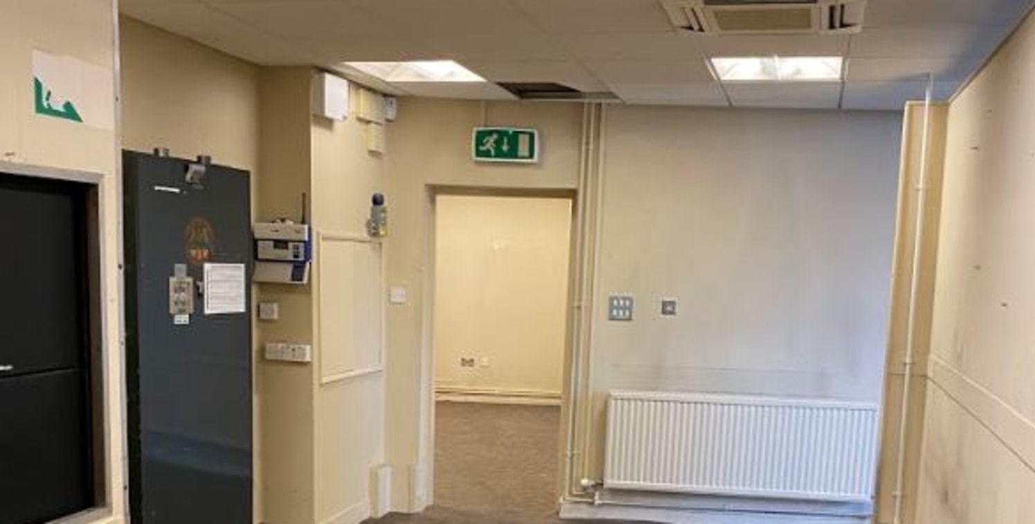 The accommodation has curved frontage around the junction of Wigan Road and Gerard Street and comprises ground and first floor. The ground floor forms a former banking hall/retail area, offices and a strong room while the first floor provides ancilla...