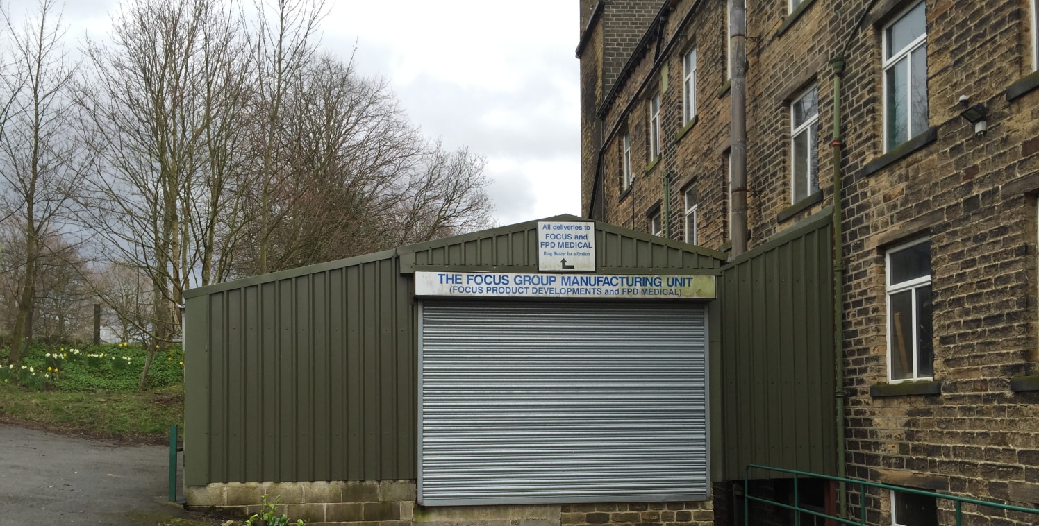 This accommodation forms part of the upper ground floor of the site's principal building, a five-storey former textile mill of stone construction beneath a pitched slate roof, together with part of the first floor of the adjacent extension mill, toge...