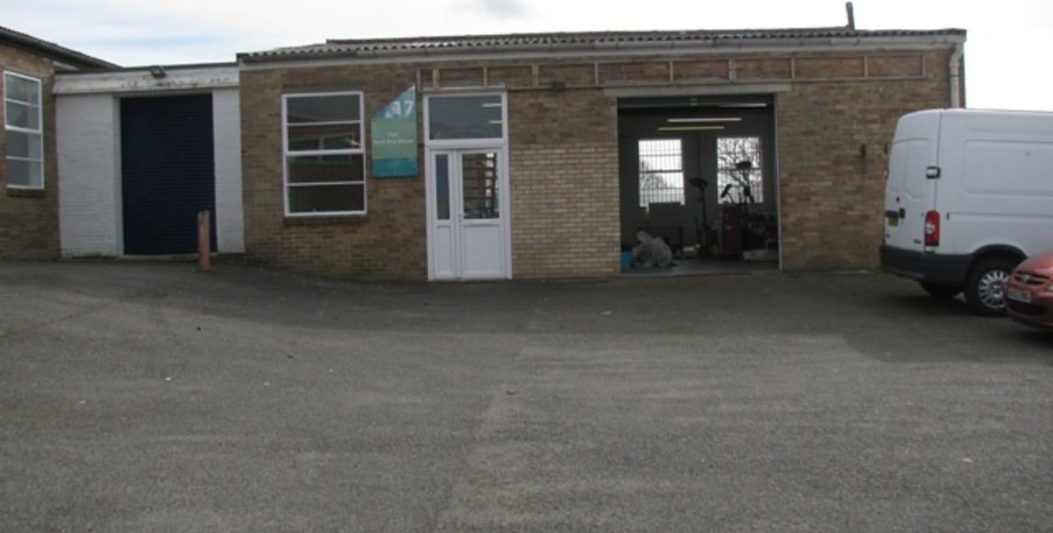 The premises comprise a self-contained concrete frame unit with brick elevations under a corrugated pitched roof. Location The unit is located on the well established Station Road Industrial Estate which is on the southern side of Station Road.