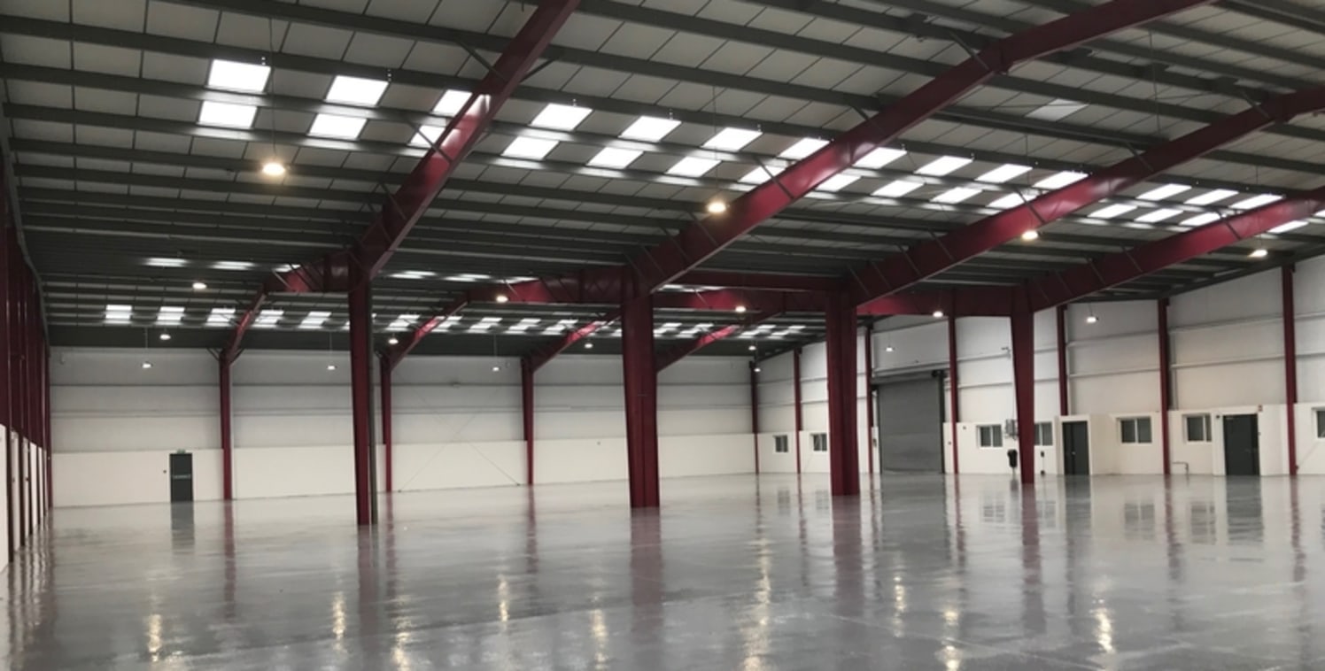 The unit comprises of a detached warehouse of steel portal frame construction with part brick, part profile metal sheet elevations under insulated a pitched...