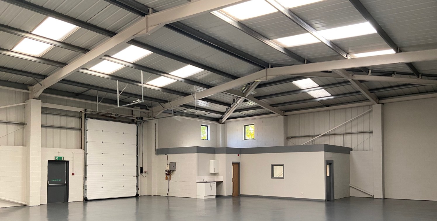 Unit 1 comprises a prominent modern semi-detached industrial unit built of steel portal frame with brick and metal profile cladding set within a shared fenced and gated yard. The extensively refurbished property benefits from good-quality office spac...