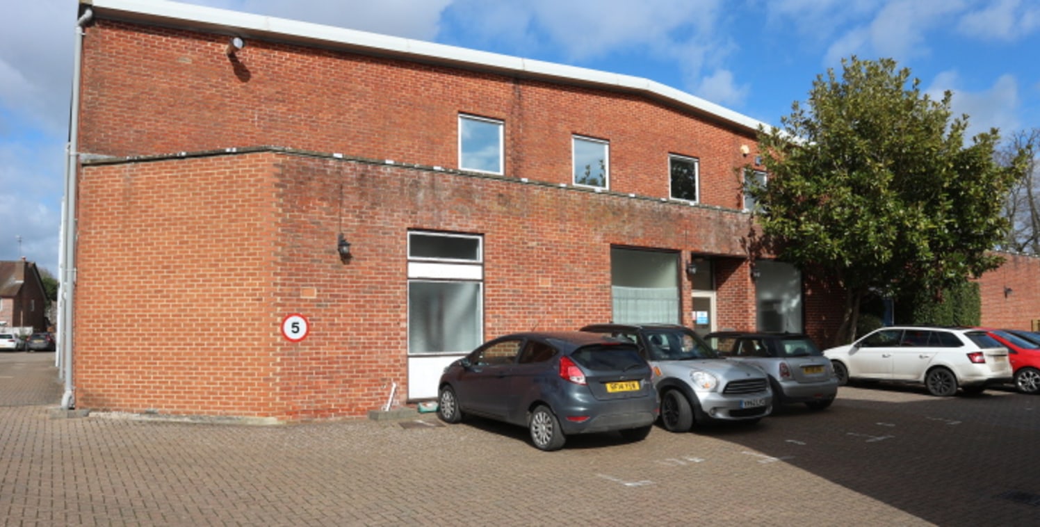 A detached, self-contained industrial/warehouse building with ancillary first floor offices.