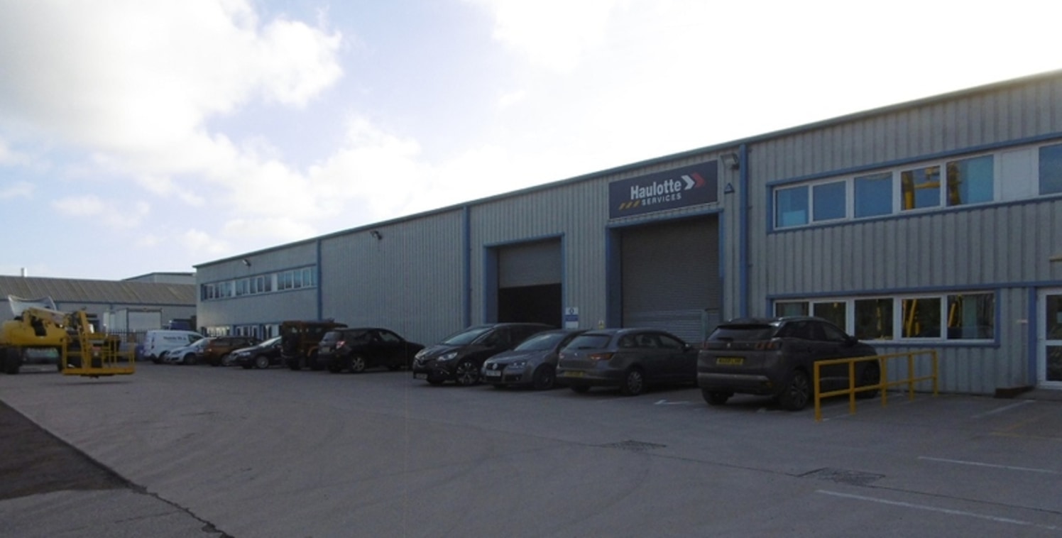 The property provIdes a modern IndustrIal premIses benefItIng from a large surfaced and fenced front yard. The unIt Is accessed vIa two roller shutter doors to the front elevatIon and has an Internal eaves heIght of approx. 6.2m (5....