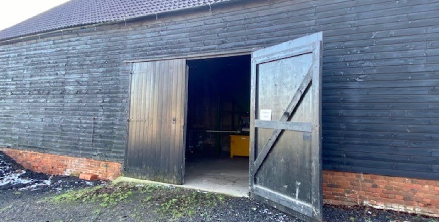 The property comprises a Timber framed barn structure with timber weatherboard elevations.

The property is secure and wind and watertight.

Internally the space includes:-

* Concrete floor

* 3 phase power

* Strip lighting

* Eaves height of 4.2m...