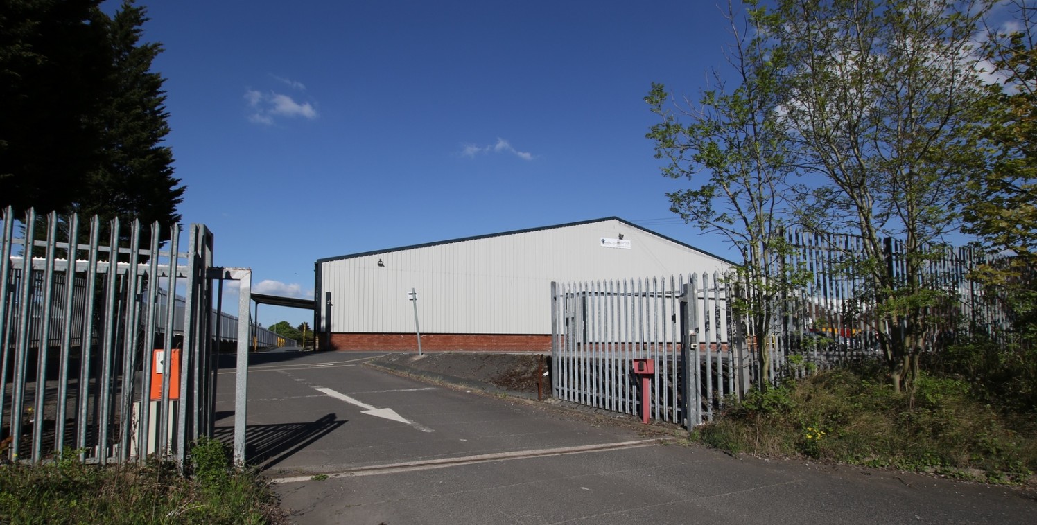 **Long Leasehold** The property comprises a refurbished two storey office building fronting the ring road. To the rear of this is a north-lit warehouse leading to a self contained large warehouse with yards to 3 sides. Access to the property is provi...