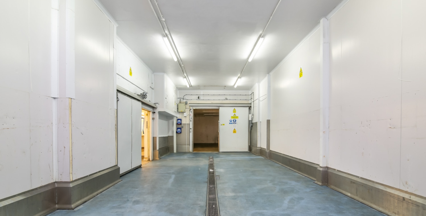 Unit 26 forms part of the terrace of single storey warehouses inside Kent Park Industrial Estate, the warehouses comprise full brick elevations of a portal frame construction with concrete floors. Loading access is via the electric roller shutter doo...
