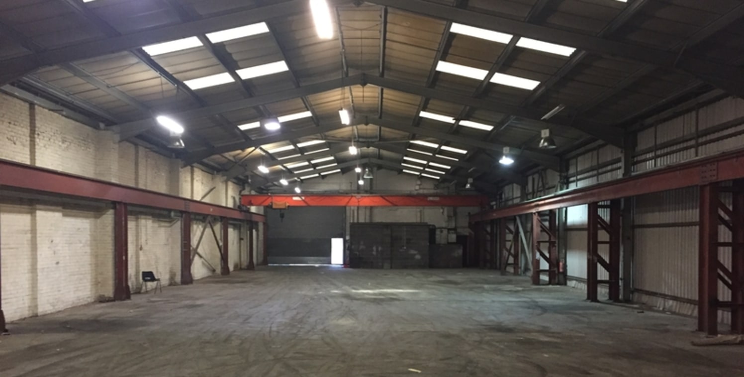 The property is of a steel portal frame construction beneath a pitched lined roof, incorporating intermittent translucent roof lighting. The front of the premises are made up of first storey offices providing a mixture of cellular and open plan offic...