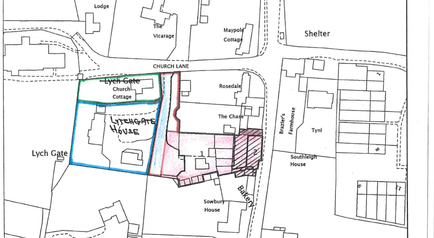 The property currently comprises a former bakery with a number of timber structures.

Once the current tenants have left then the site will be clearer but mainly it comprises level land accessed via a private drive from the adopted Church Lane.