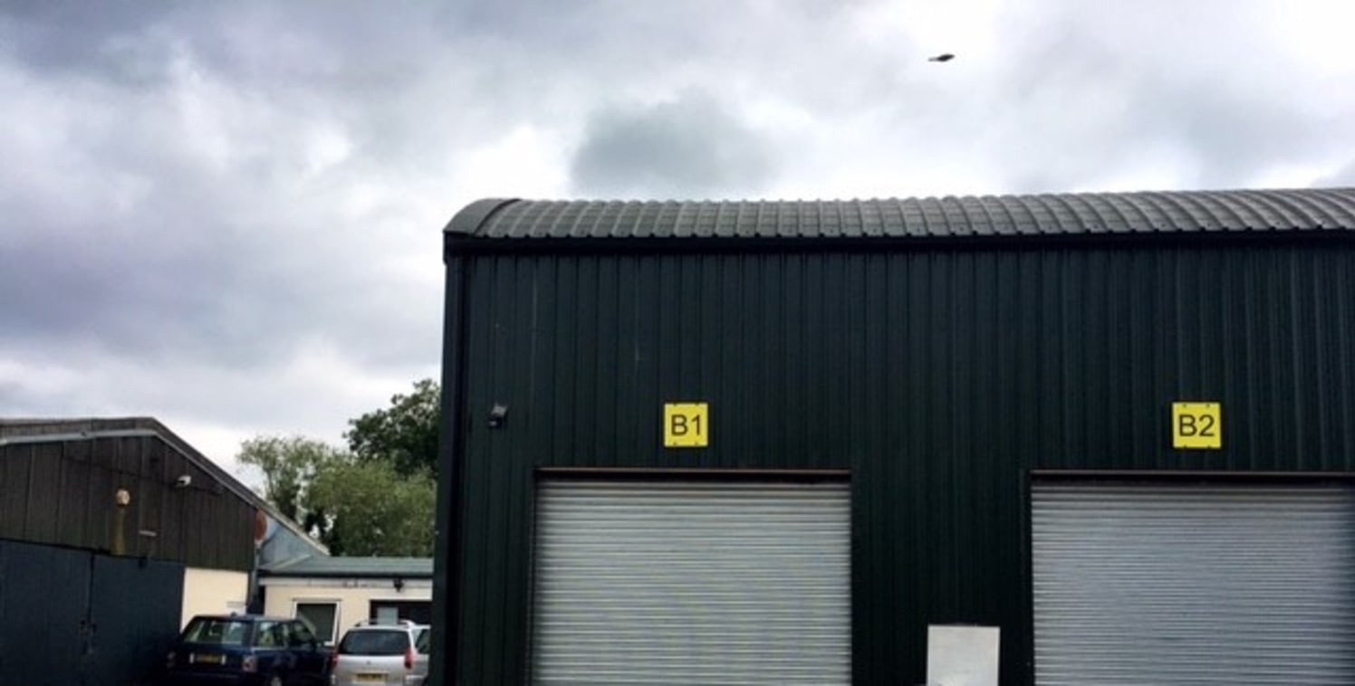 The property sits on a small estate of similar light industrial units.

The property itself comprises profile metal clad elevations over blockwork walls.

Internally the property includes concrete floor, electric roller shutter door to the front with...