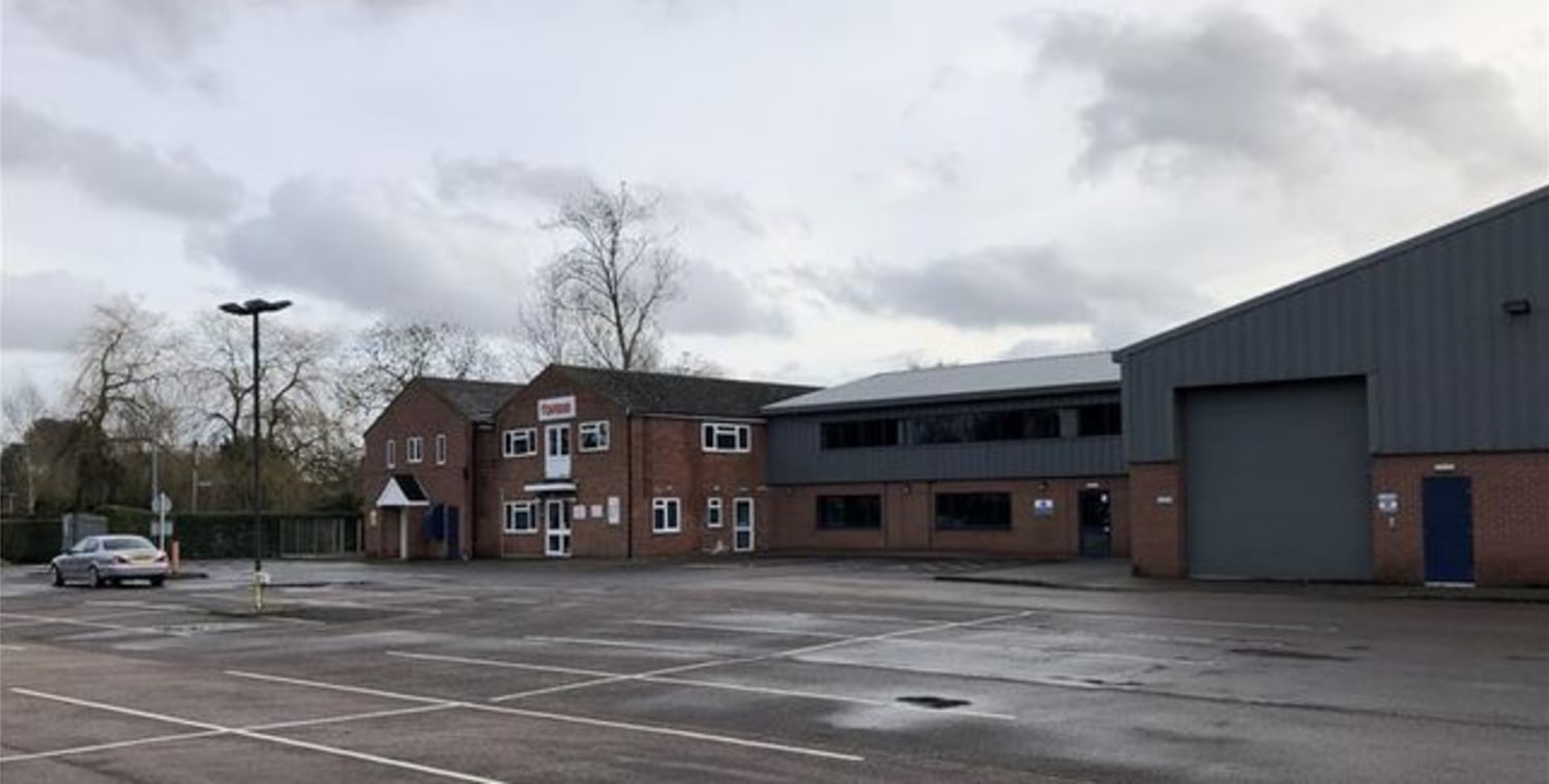 The property comprises a small industrial estate with a mix of industrial, showroom and business premises numbering 17 units of varying size and type and set on a site of approximately 4.2 acres. To the centre of the estate is a large surfaced car .....