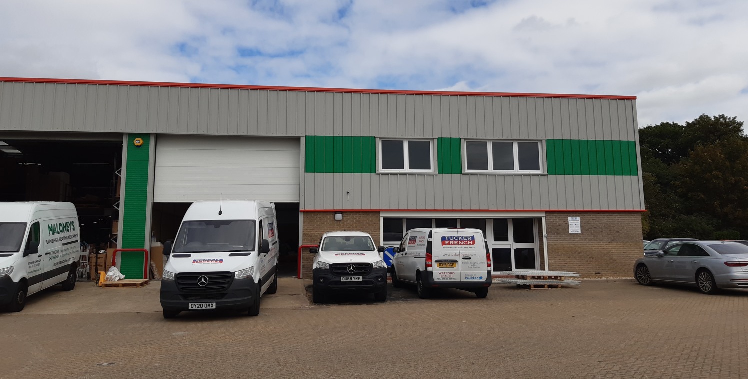 A new end of terrace warehouse / industrial unit constructed of steel portal frame with brick/block elevations at ground level and coated steel cladding above and on the roof.

There is a small office at ground and first floor.