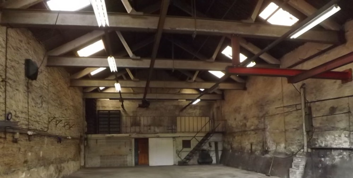 LOCATION\n\nThe property is situated within the St Hubert's Mill complex just off Cambridge Street on the edge of Great Harwood town centre.\n\nDESCRIPTION\n\nThe property comprises a self-contained workshop that has been used in the past as a Blacks...