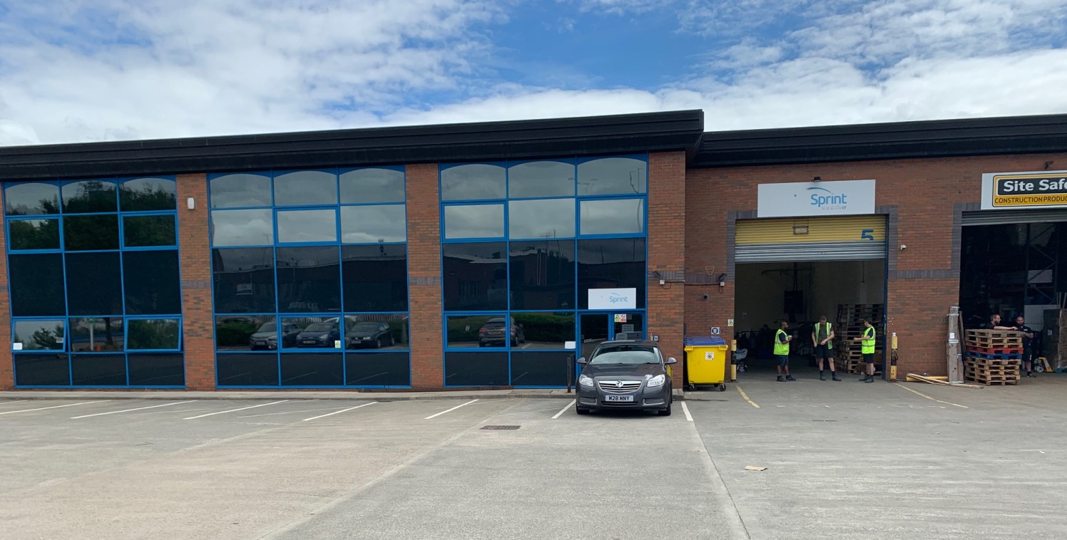 The property is a modern mid-terraced warehouse unit with ancillary offices and benefits from a shared yard. The unit is accessed via a roller shutter door and separate personnel door. There is lighting and heating to the warehouse. The premises also...