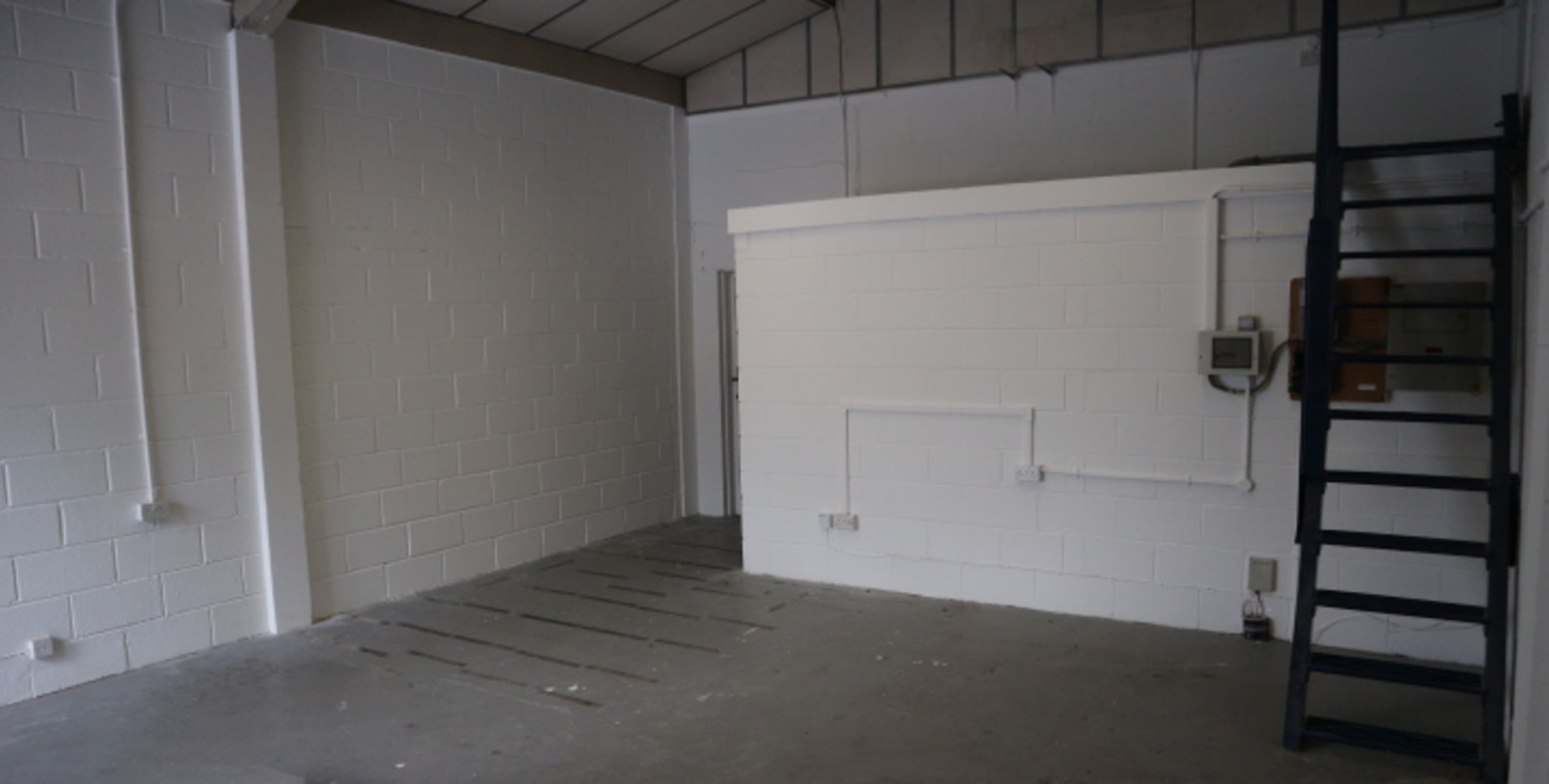 The unit comprises a self-contained starter industrial / warehouse unit with a large loading door and car parking.