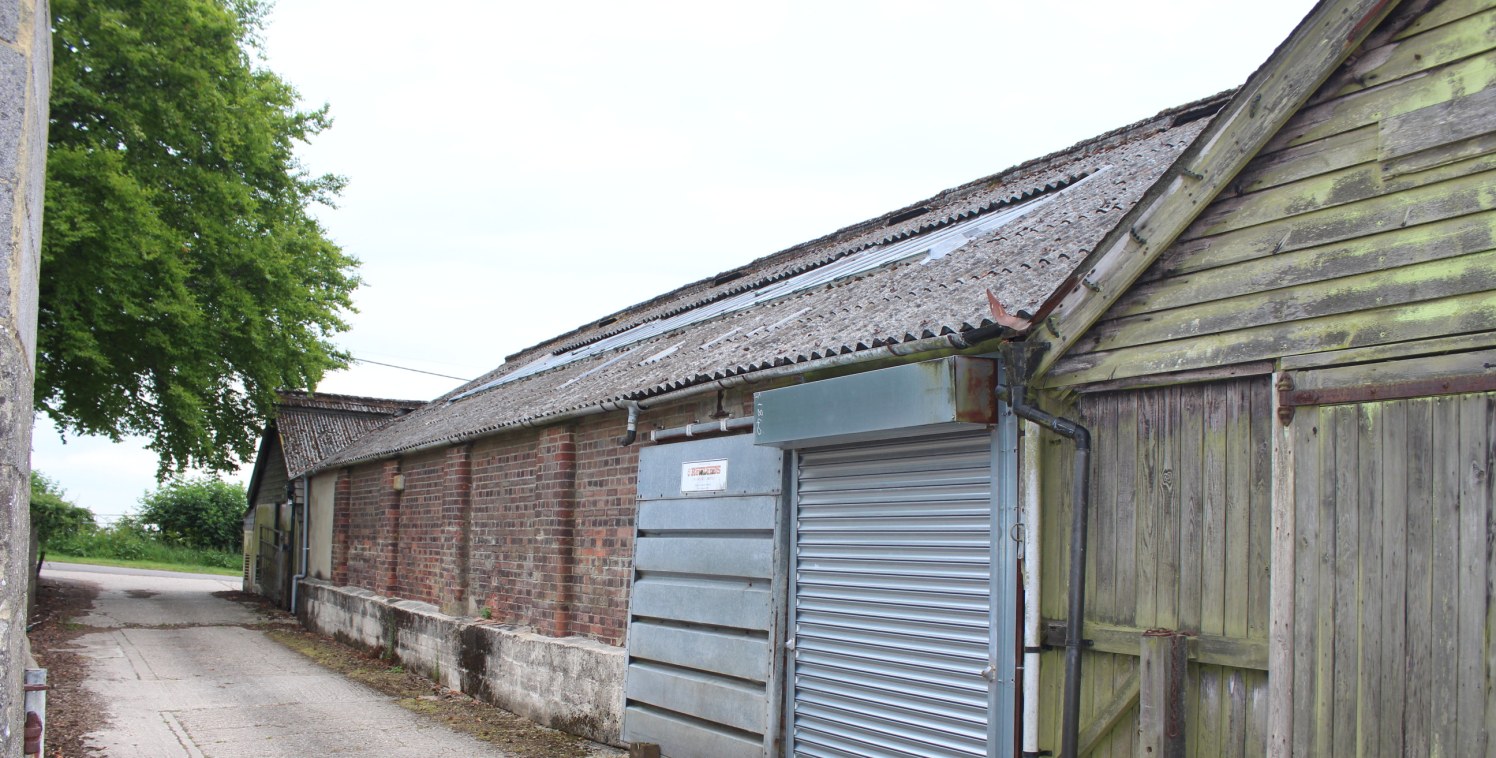 The property comprises a storage building with large loading door (not wide enough for vehicles), solid floor, strip lights and an eaves height of 2.25m rising clear.

2 parking spaces are available - more storage space may be available if required.