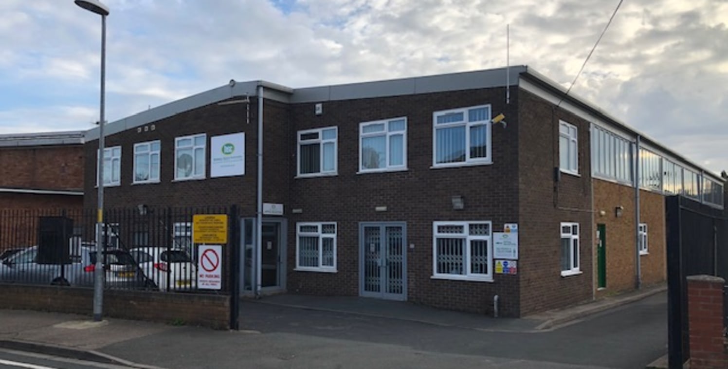 6,939 sq ft industrial unit with office accommodation. Main reception with showroom and kitchen, stairs leading up to the offices. Yard space to the rear.