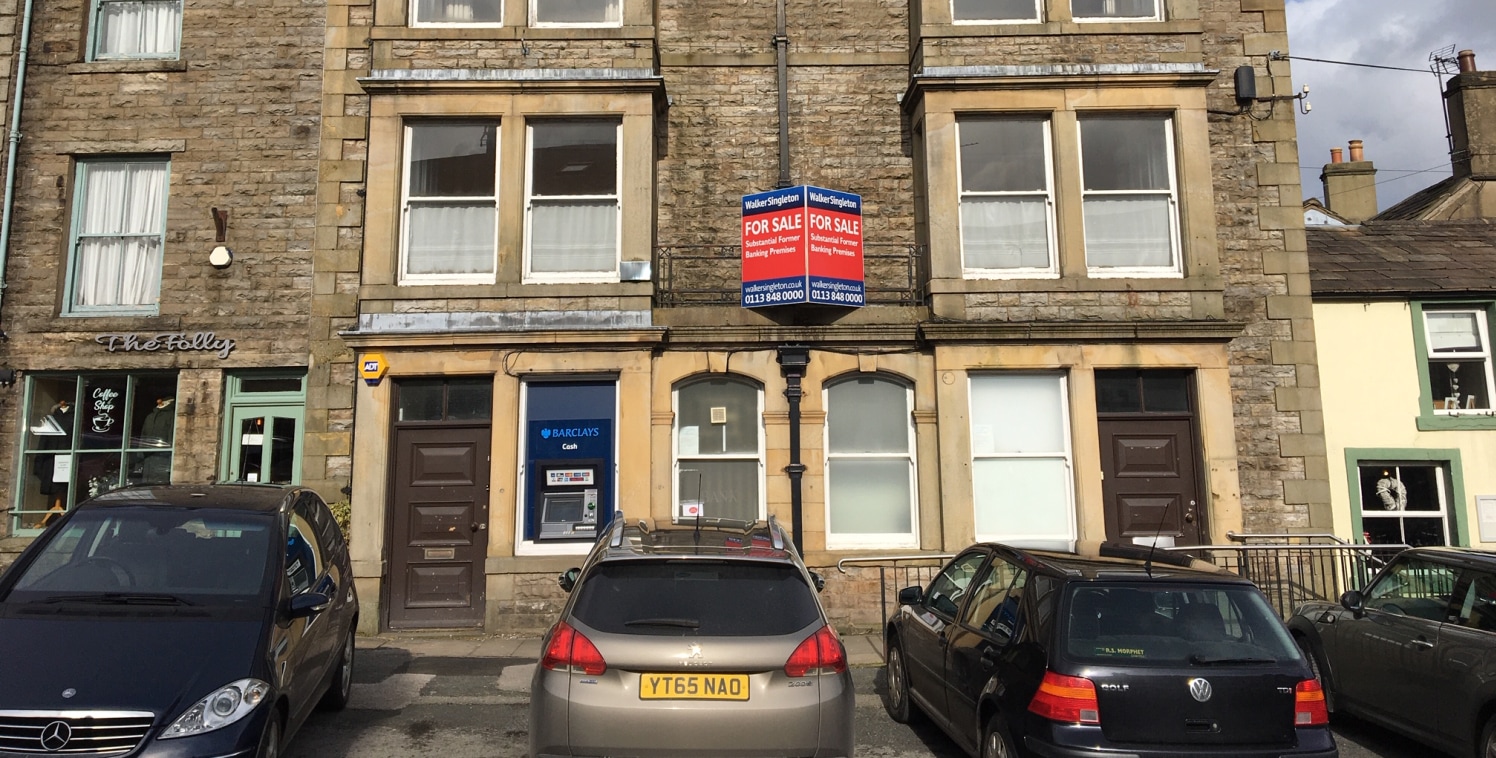 The property comprises a substantial three storey stone built former banking premises under a pitched slate covered roof. Internally the accommodation briefly comprises a banking hall, vault, office and stores at ground floor level, with three office...