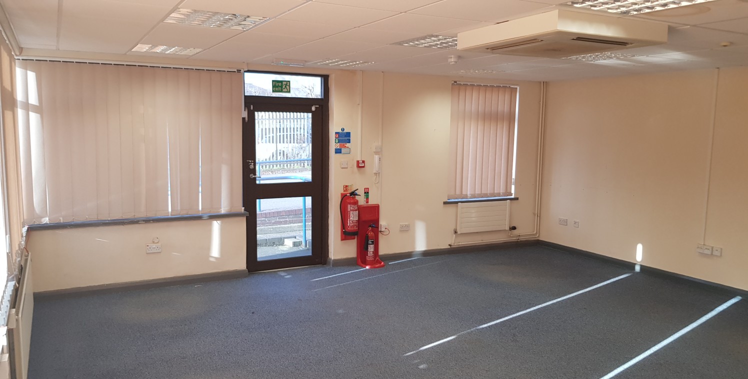 The property includes a large yard area which is shared in part with the adjacent occupier. Approximately 2,264.49 sq. m. (0.559 acres) of yard is available excluding parking.

In the main the property comprises brick built offices with flat roof wit...