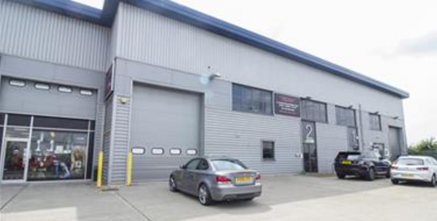 The property comprises a modern steel portal framed mid-terraced warehouse/storage unit constructed in approximately 2006 of part blockwork elevations covered with profile sheet metal cladding to a mono pitched roof. The warehouse also benefits from...