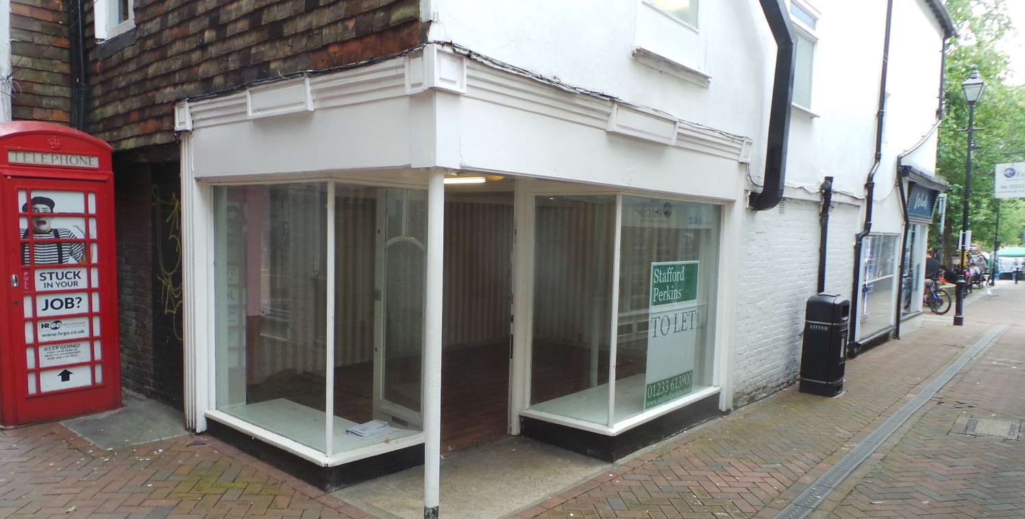 This small, end of terrace ground floor lock-up shop benefits from a large window frontage and has A1 retail use or other use subject to planning permission being granted. The basement is accessed via a trap door behind the counter and has WC facilit...