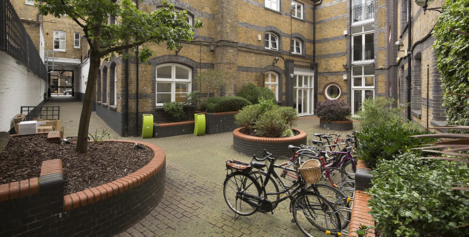A character office unit within a gated courtyard development. The unit is on the first floor and benefits from excellent natural light and a juliette balcony overlooking the courtyard. The space is open plan with a kitchen and male and female WCs and...