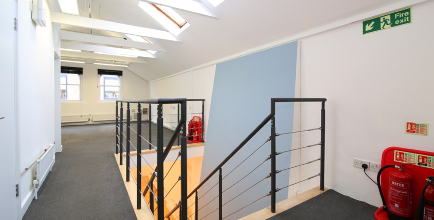 The unit has been recently redecorated and is set across two levels; ground and first floor. The ground floor is divided into three offices of varying sizes and includes an external courtyard. The first floor has an open plan configuration, with a nu...