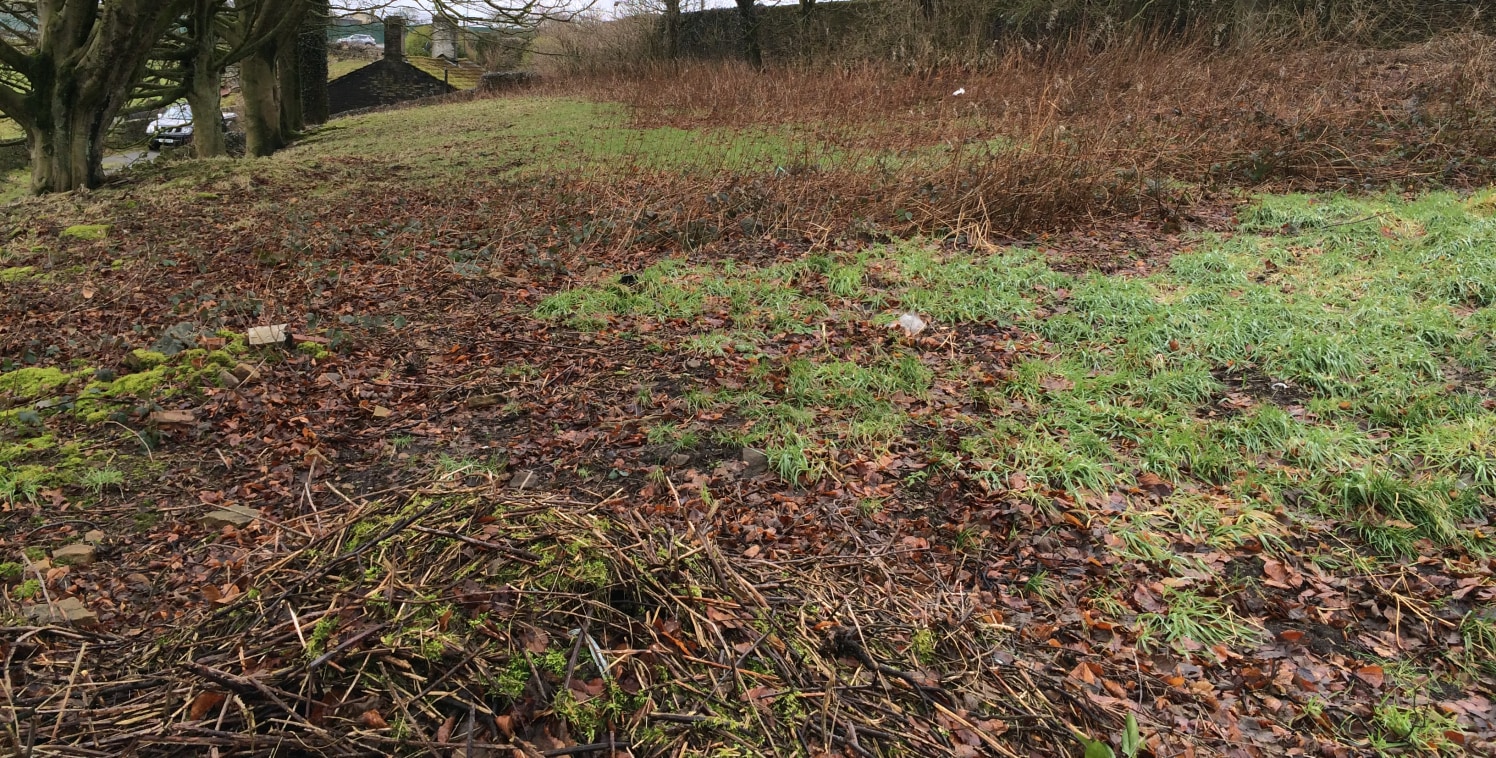 The property comprises a burial ground having pedestrian access and frontage to both Cragg Lane and Halifax Rd. The site maintains the topography of the surrounding land sloping down to Cragg Lane where it is elevated from the road. The perimeter is...