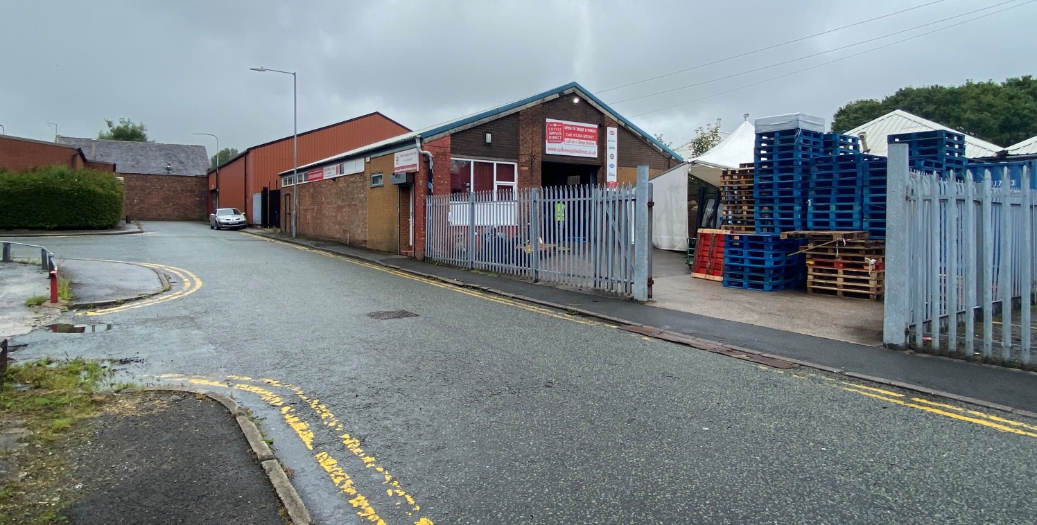 Comprising a detached, steel frame constructed workshop unit with masonary brick elevations, set beneath a metal profile clad roof covering. The property benefits from a large, self-contained concrete surfaced yard which is bound by 2m high streel pa...